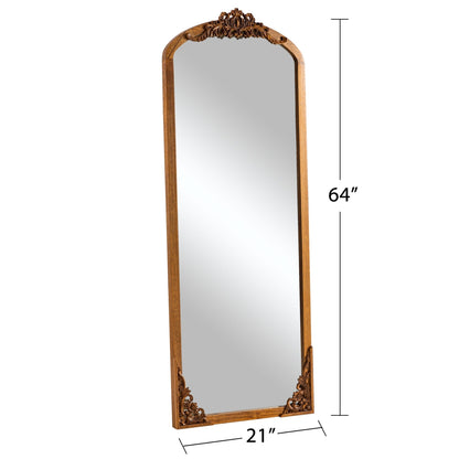 Miroir de sol sculpté en bois massif de forme arquée sur toute la longueur