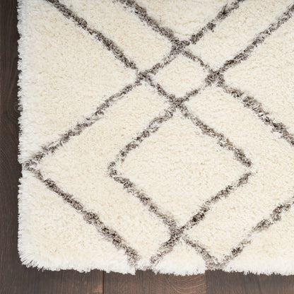 Tapis Nourison luxueux à poils longs et ultra moelleux, motif géométrique abstrait
